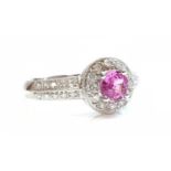 An 18ct white gold pink sapphire and diamond halo cluster ring,