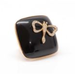 A rose gold onyx and diamond set plaque ring,