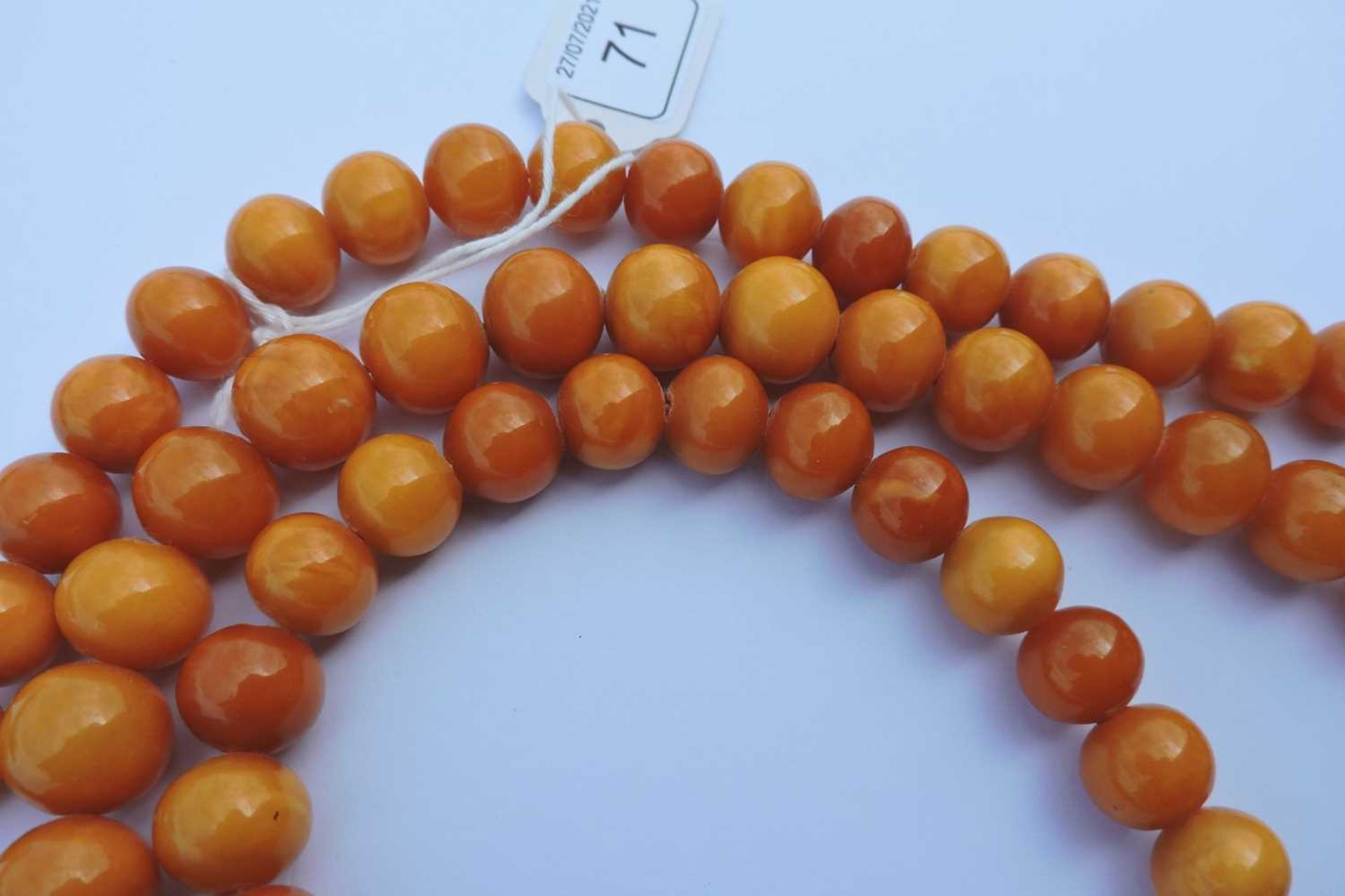 A single row uniform spherical butterscotch amber bead necklace, - Image 6 of 6
