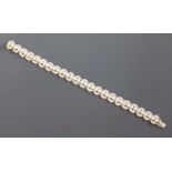 A white gold cultured pearl and diamond bracelet,