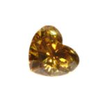 An unmounted fancy orangey yellow heart shaped brilliant cut diamond,