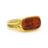 A high carat gold carved cornelian intaglio ring,