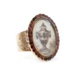 A Georgian garnet set memorial ring,