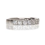 A platinum diamond set half eternity ring,