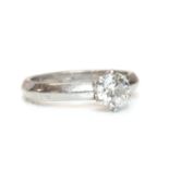 A platinum single stone diamond ring,