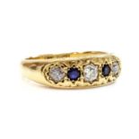 A gold five stone diamond and sapphire ring,