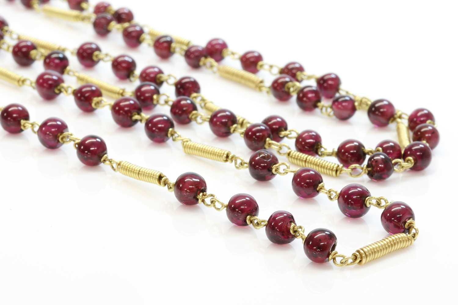 An Italian gold garnet necklace,