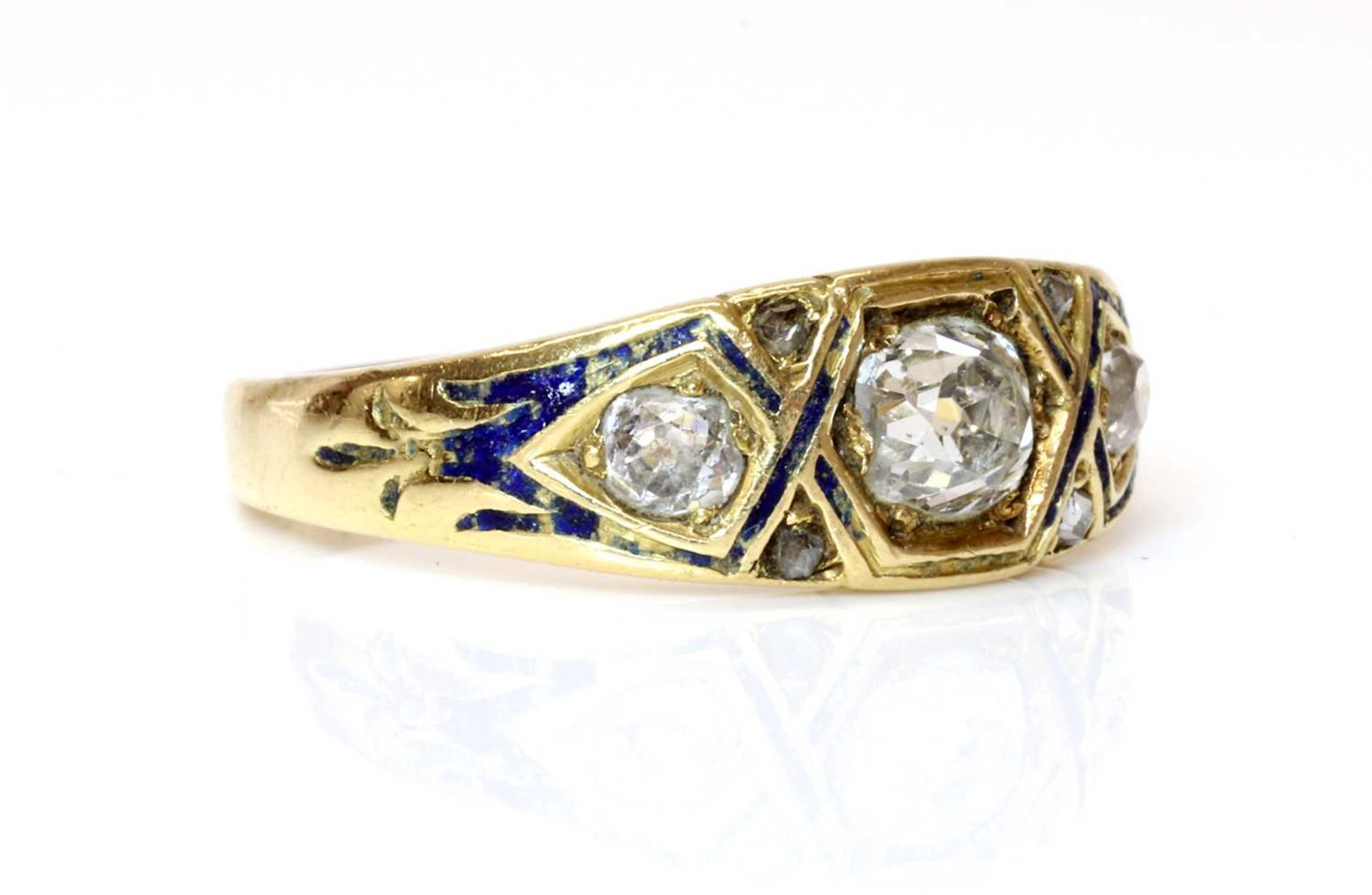 A Victorian three stone graduated diamond and enamel ring, c.1860,