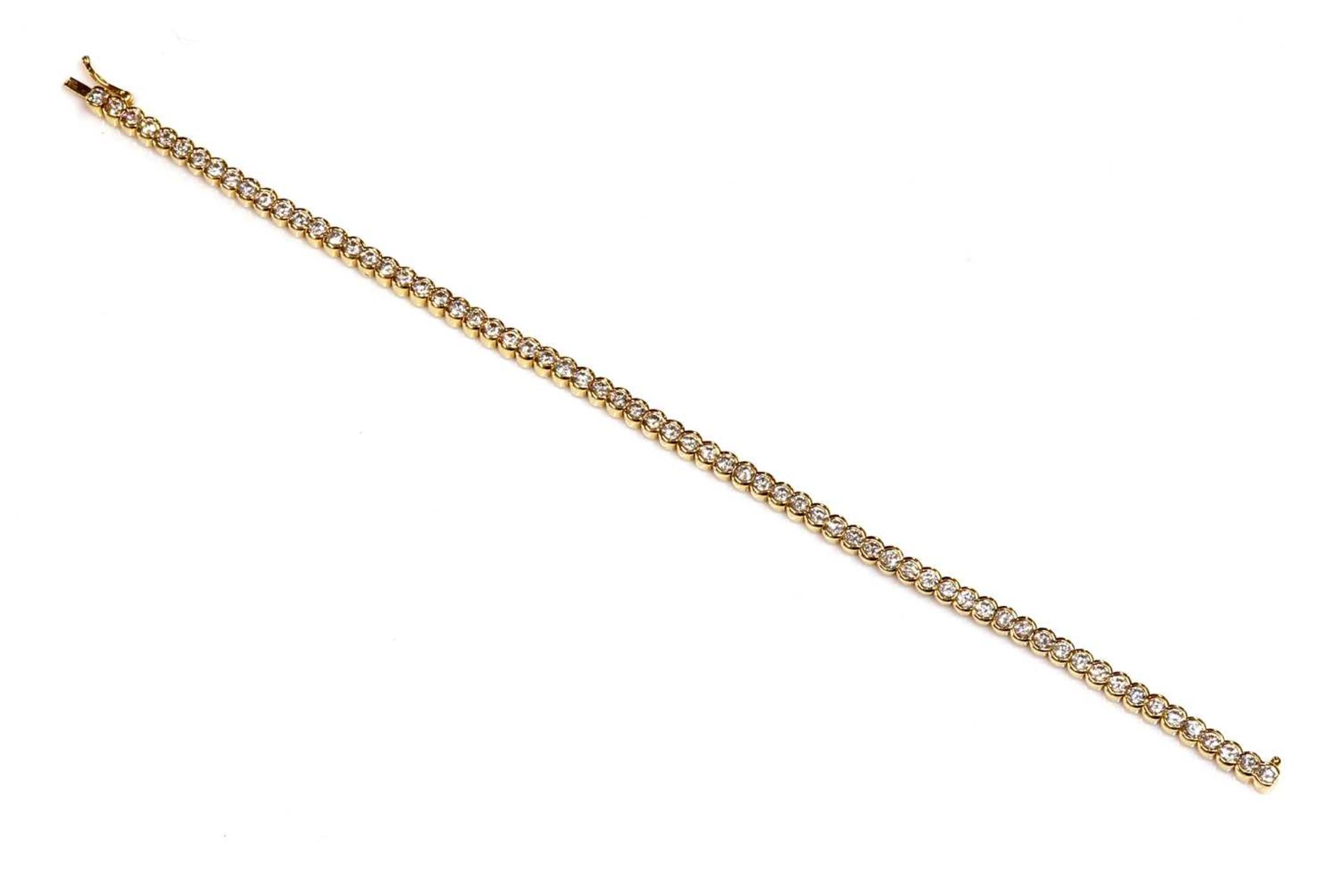 An 18ct gold diamond set line bracelet, retailed by Hamilton & Inches,