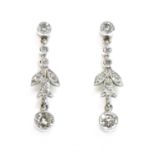 A pair of platinum diamond drop earrings,