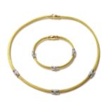 An 18ct yellow and white gold diamond set necklace and bracelet suite, by Italian Lynx,