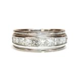 An 18ct white gold diamond half eternity ring,
