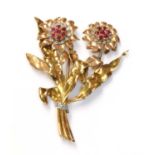 A three colour gold, ruby and diamond spray brooch, c.1940,