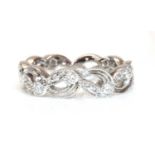 An 18ct white gold pierced diamond set band ring,