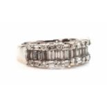 An 18ct white gold diamond set half hoop ring,