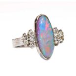 A white gold opal doublet and diamond ring,