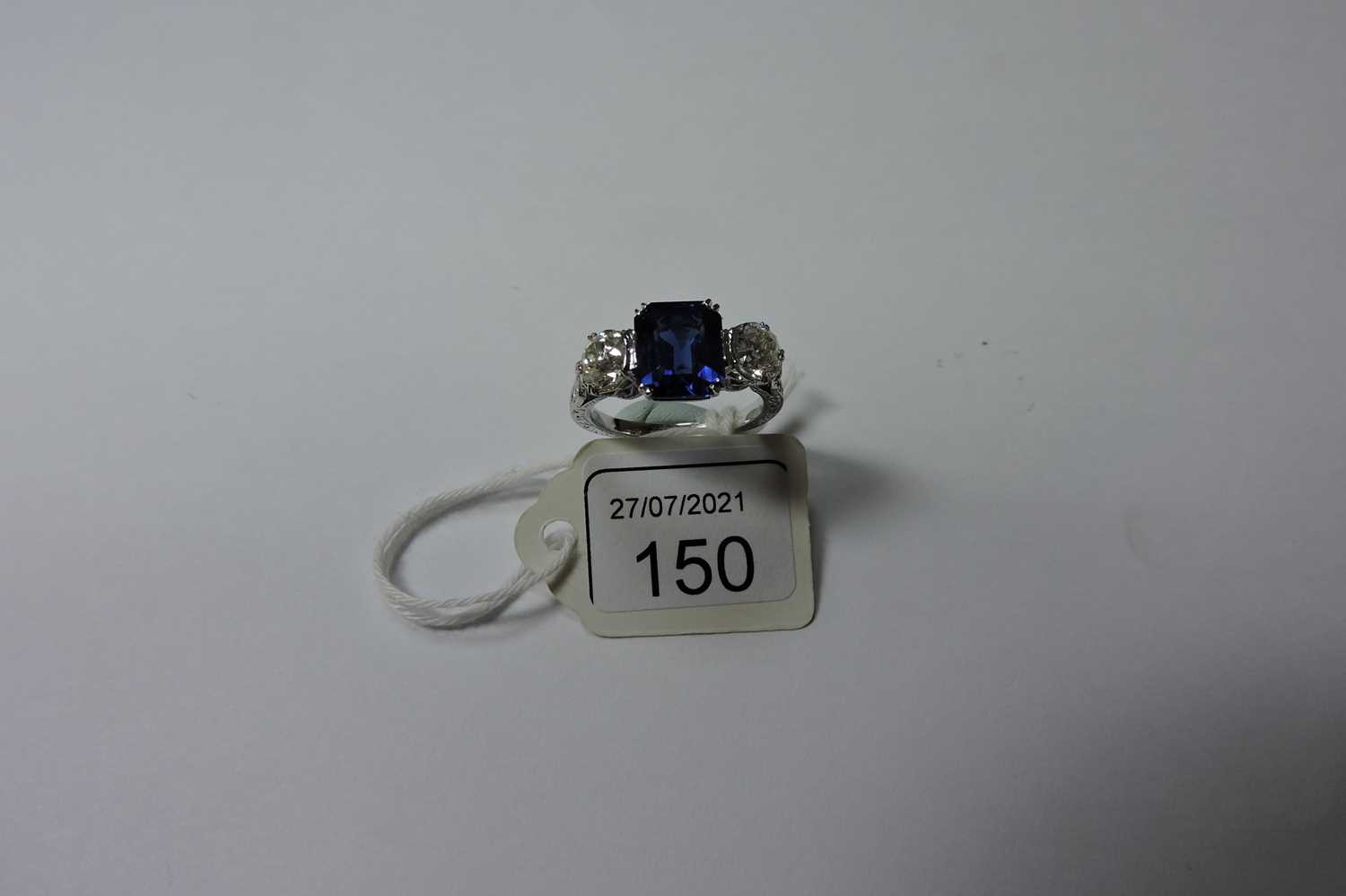 A three stone sapphire and diamond ring, - Image 6 of 6