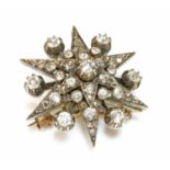 A Victorian diamond set star brooch, c.1890,