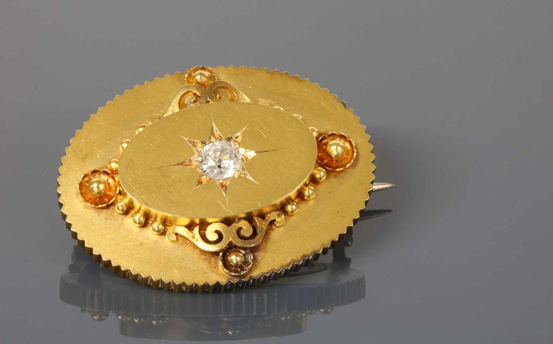 A Victorian gold diamond set oval shield form brooch, c.1870, - Image 2 of 2