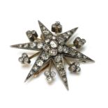 A late Victorian diamond set star brooch/pendant, c.1890,