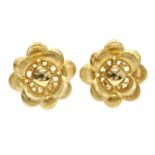 A pair of Italian gold hollow flower head earrings,