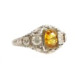 An Art Deco style yellow sapphire and diamond ring,