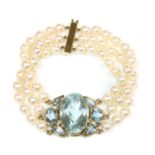 A 9ct gold aquamarine and cultured pearl bracelet, by Cassandra Goad, c.1998,