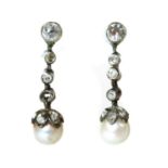 A cased pair of early 20th century pearl and diamond drop earrings,