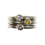 A set of three 18ct white gold diamond set stacker rings,