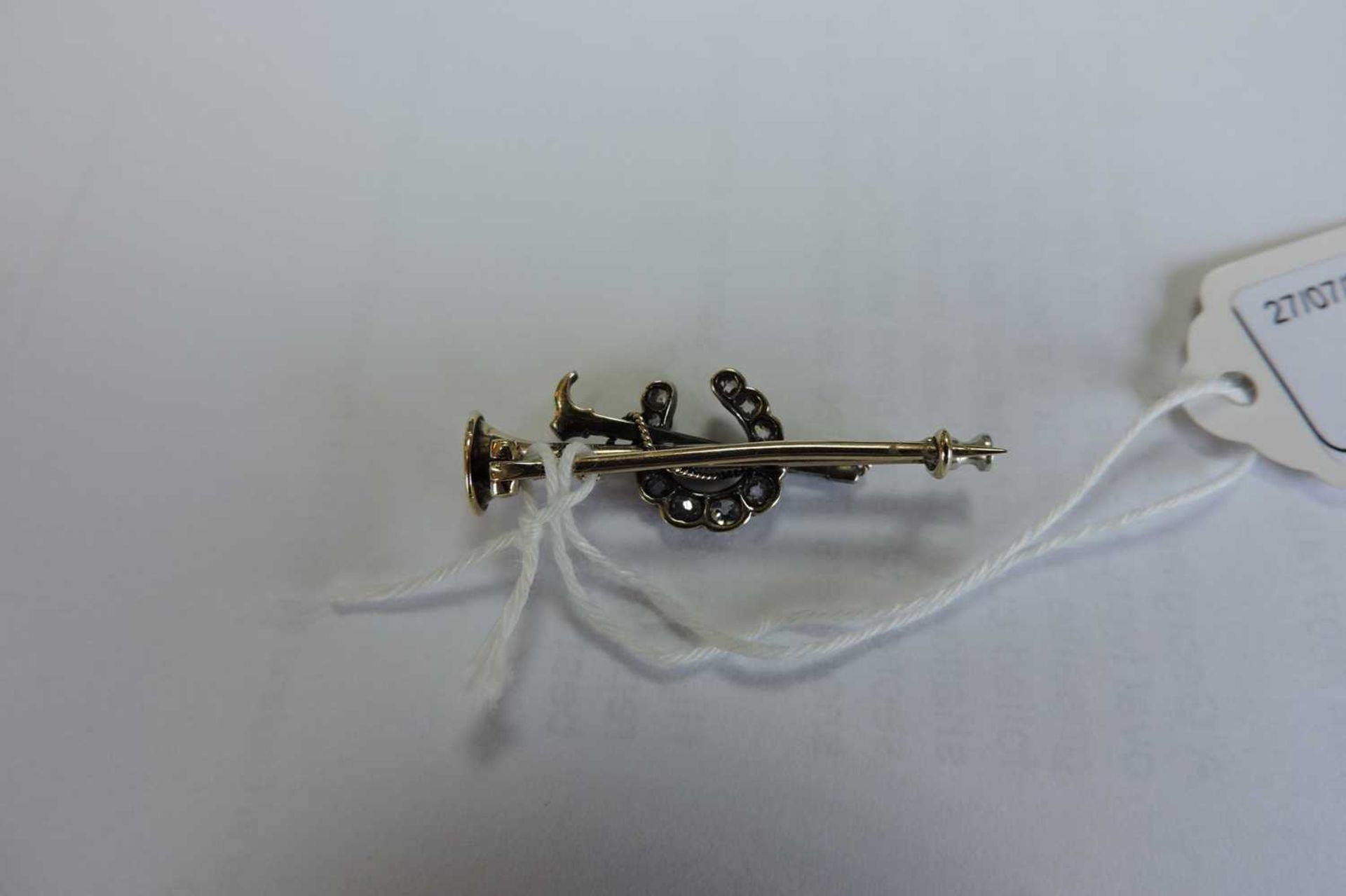 A cased diamond set hunting horn, horseshoe and crop bar brooch, c.1900, - Image 5 of 5