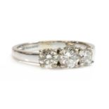 An 18ct gold three stone diamond ring,