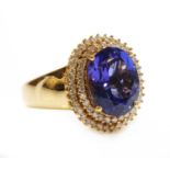 An 18ct gold tanzanite and diamond cluster ring,