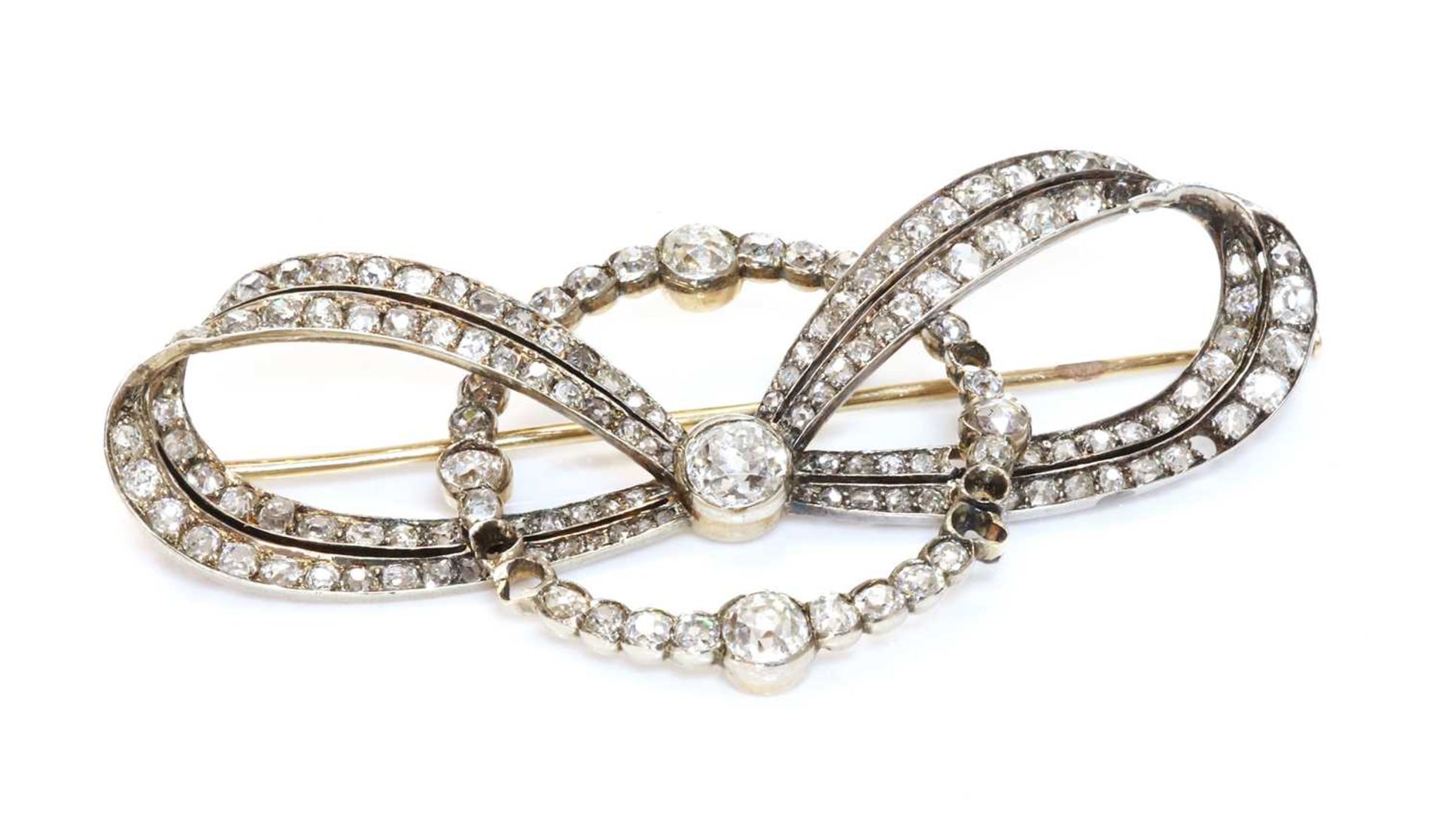 A cased former Austro-Hungarian diamond set bow and hoop brooch, by Ernest Paltsho, Vienna, c.1900, - Image 2 of 2