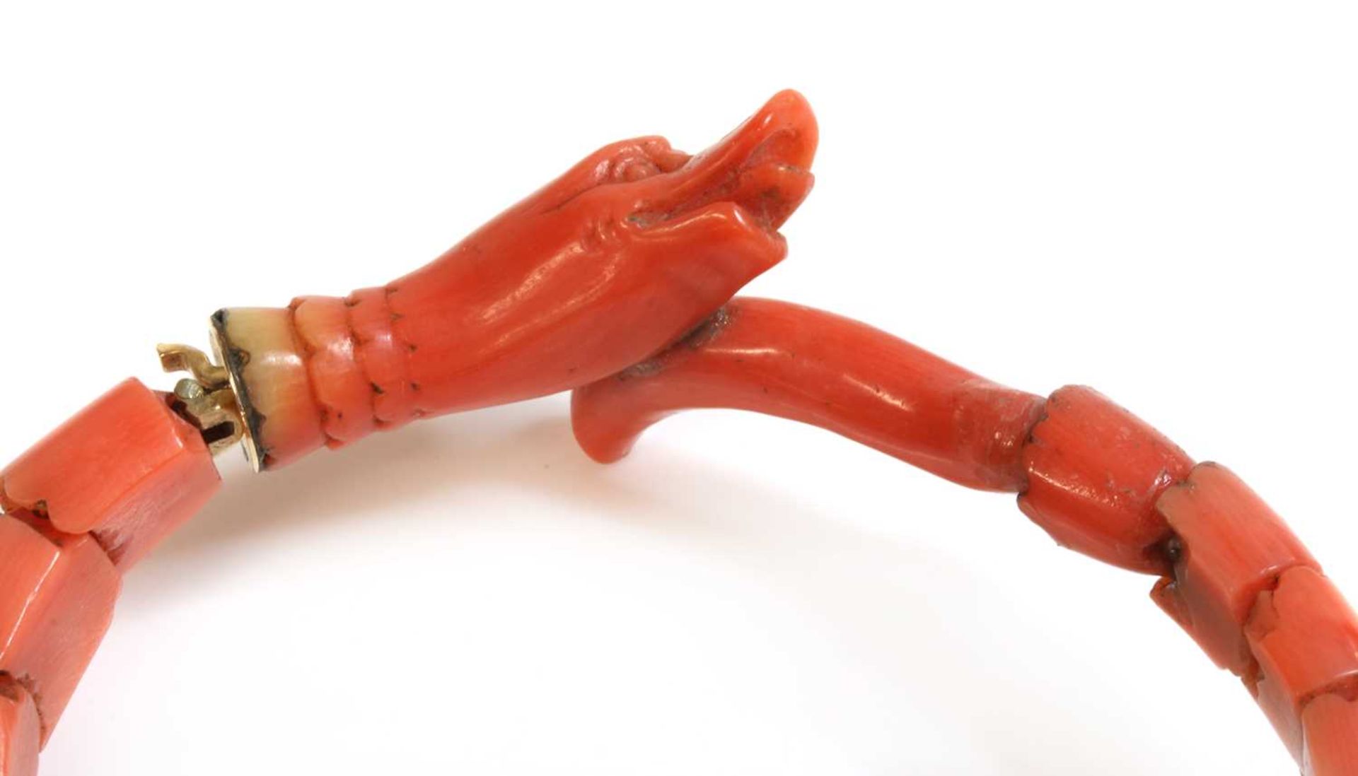 A late Victorian carved coral graduated snake bracelet, or semi flexible bangle, - Image 2 of 2