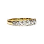 An 18ct two colour gold seven stone graduated diamond ring,