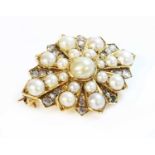 A Victorian gold split pearl and diamond star brooch or motif,