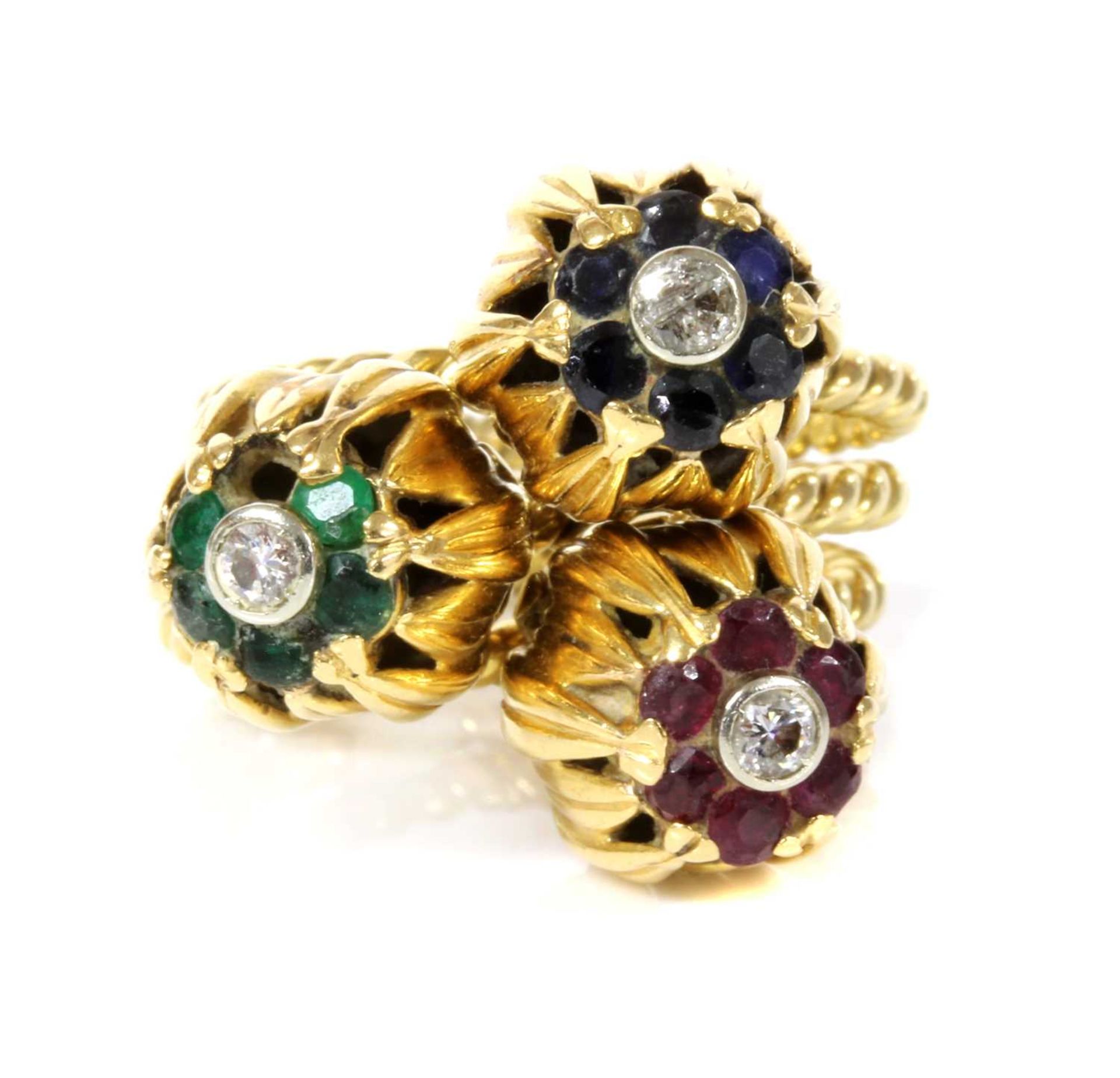 A set of three diamond and gem set stacking rings, c.1950,