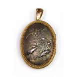 A Shakudo double sided oval hinged locket, c.1880,