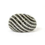 A white gold, black and white diamond bombé ring,