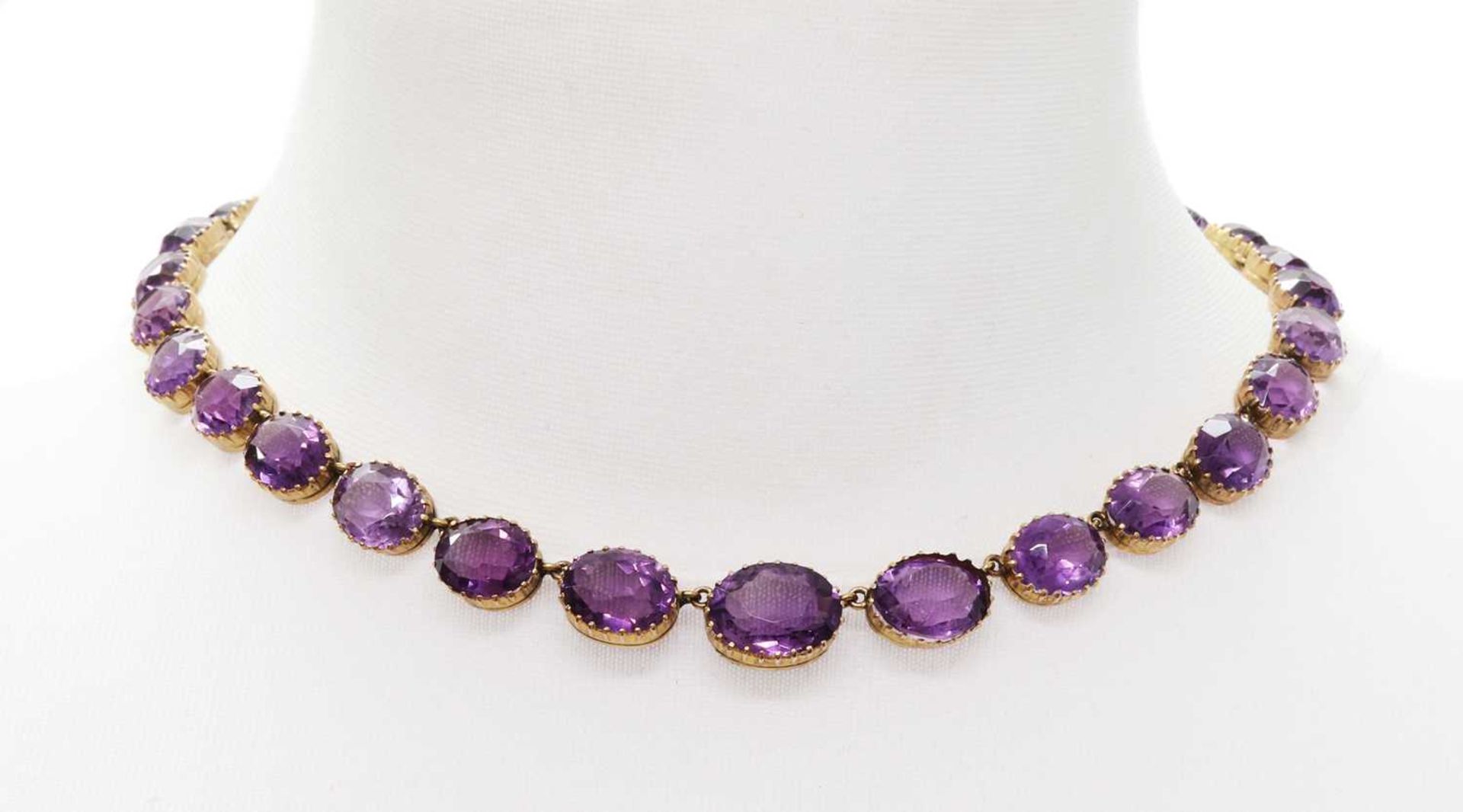 A late Victorian graduated amethyst rivière necklace,