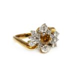 A gold diamond cluster crossover ring,