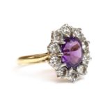 An 18ct gold amethyst and diamond cluster ring, by Arthur & Co., c.1970,