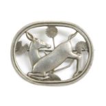 A sterling silver kneeling deer brooch, by Georg Jensen,