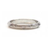 A platinum chevron section diamond set wedding ring,