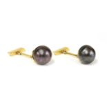 A pair of single stone cultured South Sea pearl cufflinks,