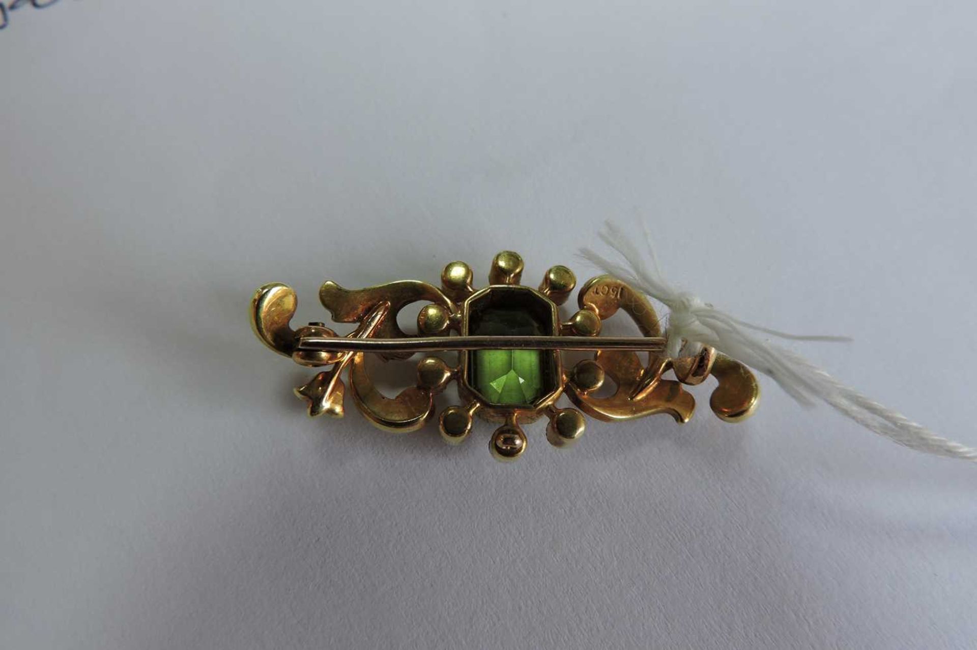 A late Victorian peridot and split pearl scrolling bar brooch, c.1900, - Image 3 of 3