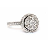 An 18ct white gold diamond set halo cluster ring,