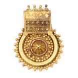 An Indian high carat gold pendant,