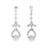 A pair of American diamond set drop earrings,