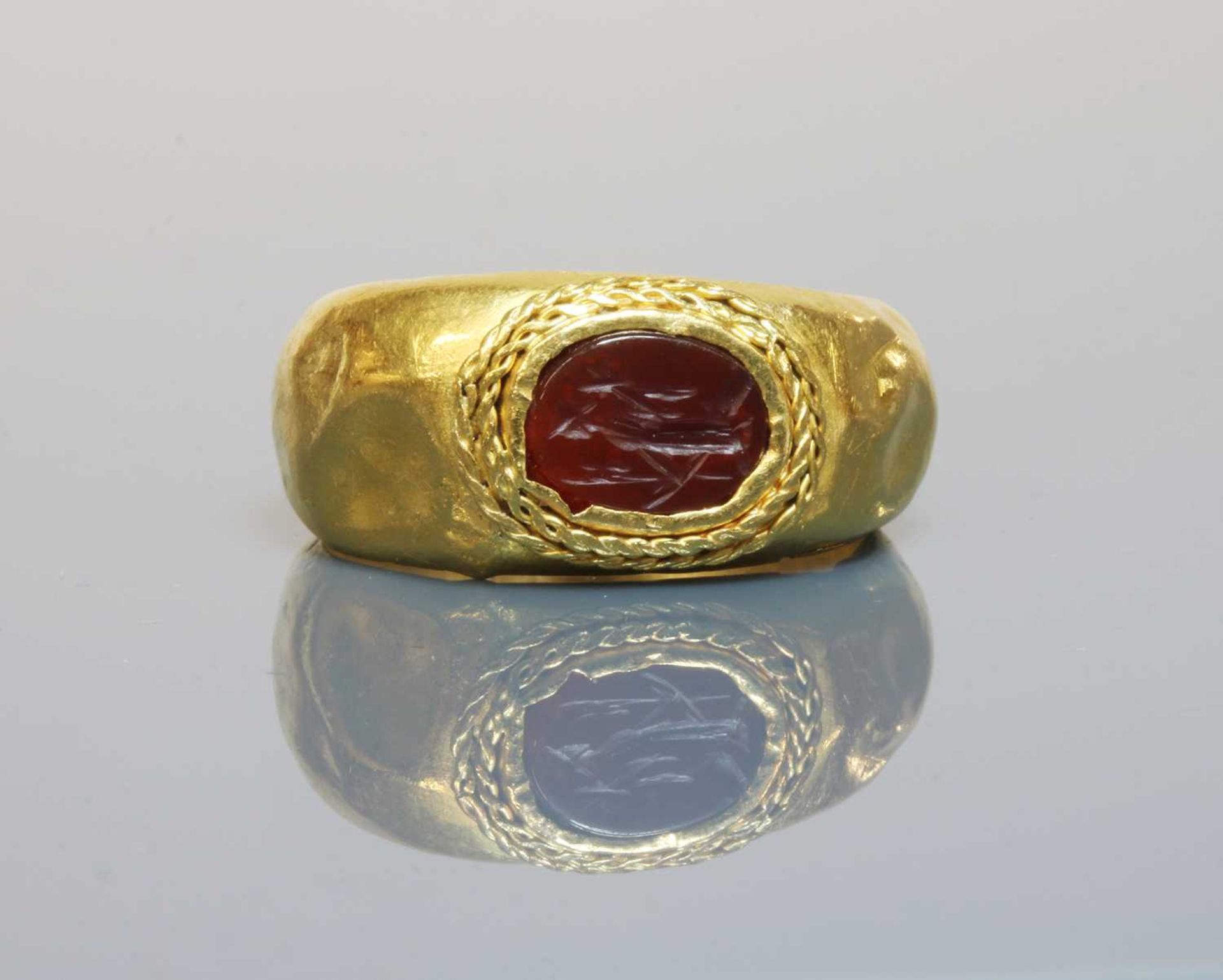 A Roman gentlemen's high carat gold cornelian intaglio ring, - Image 2 of 2